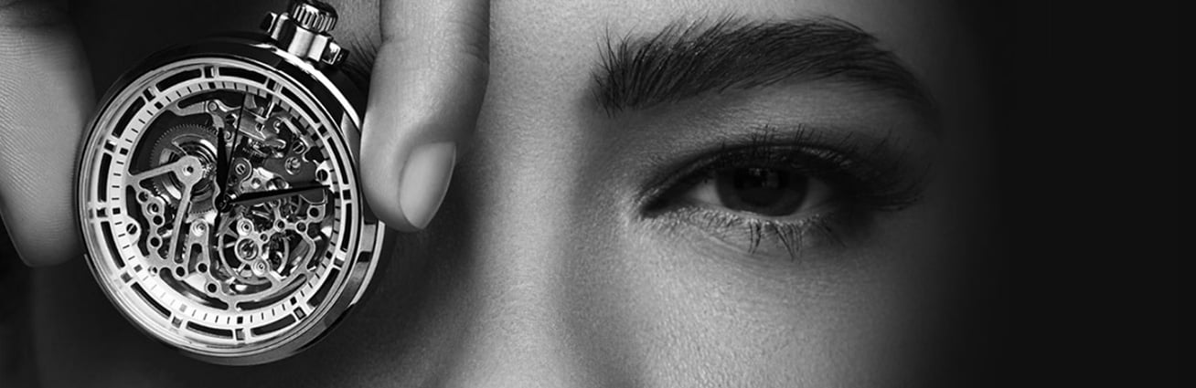 woman with watch in front of eye